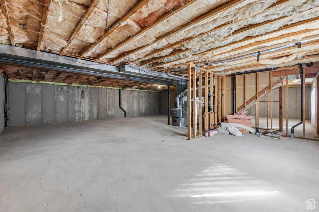 Unfinished basement with heating unit
