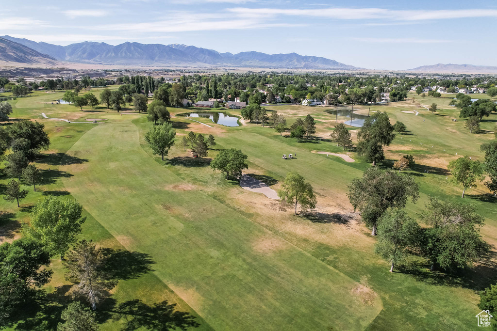 Bird's eye view of a water and mountain view and a golf club