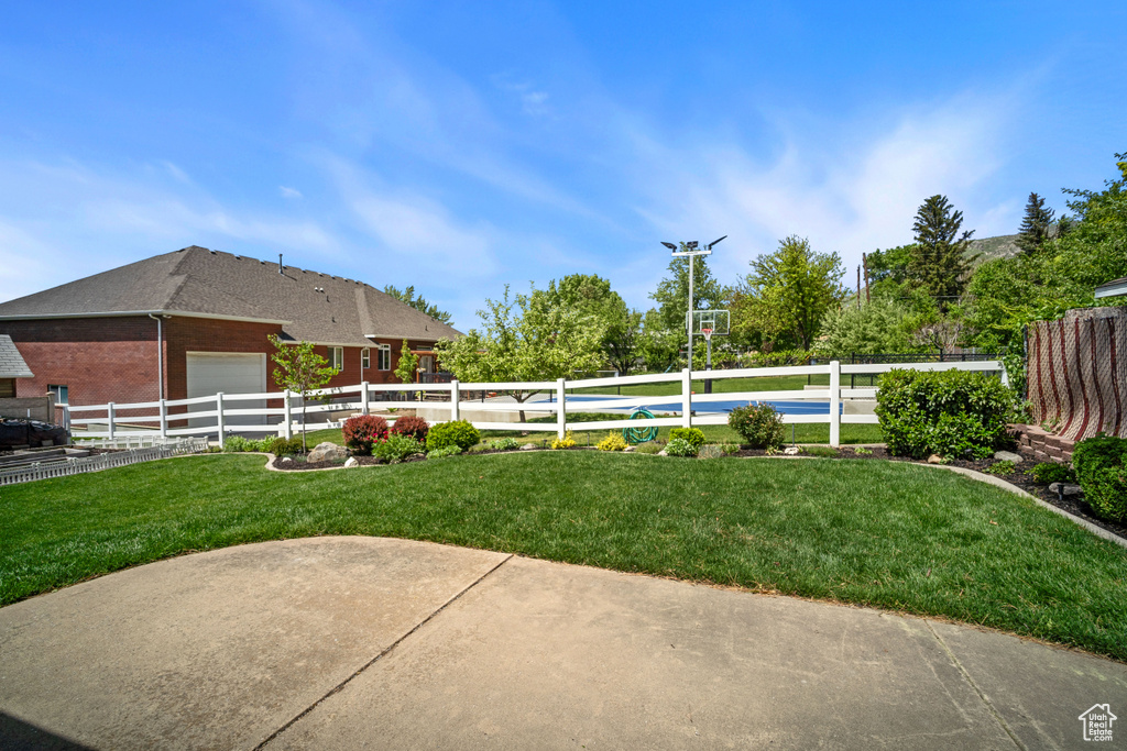 View of yard with an attached garage