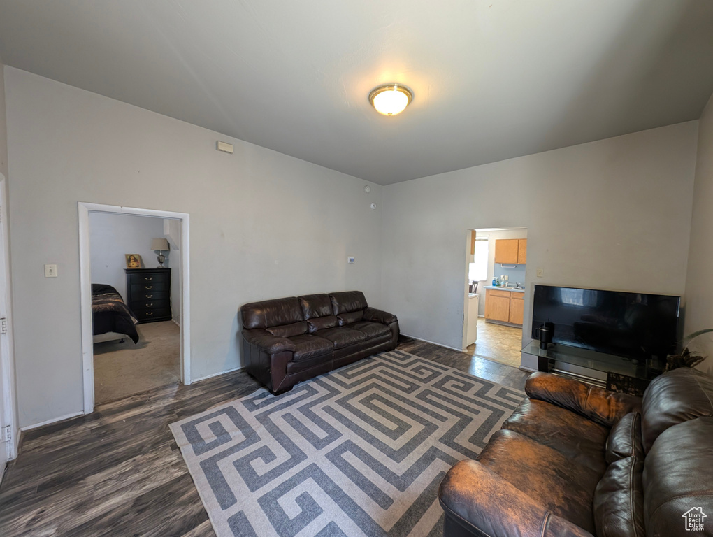 Living area featuring dark wood-style flooring