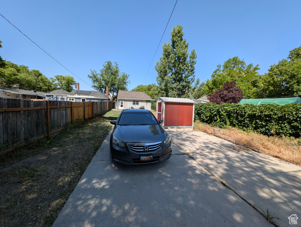Garage featuring a shed