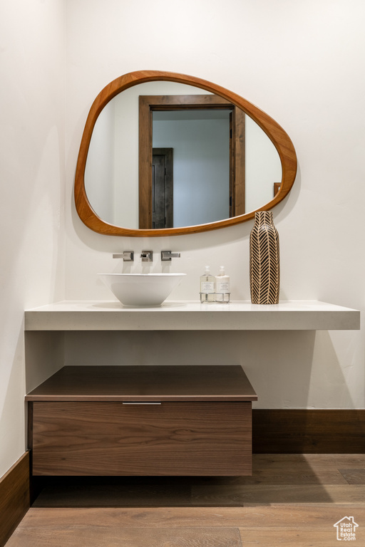 Bathroom with vanity and wood finished floors
