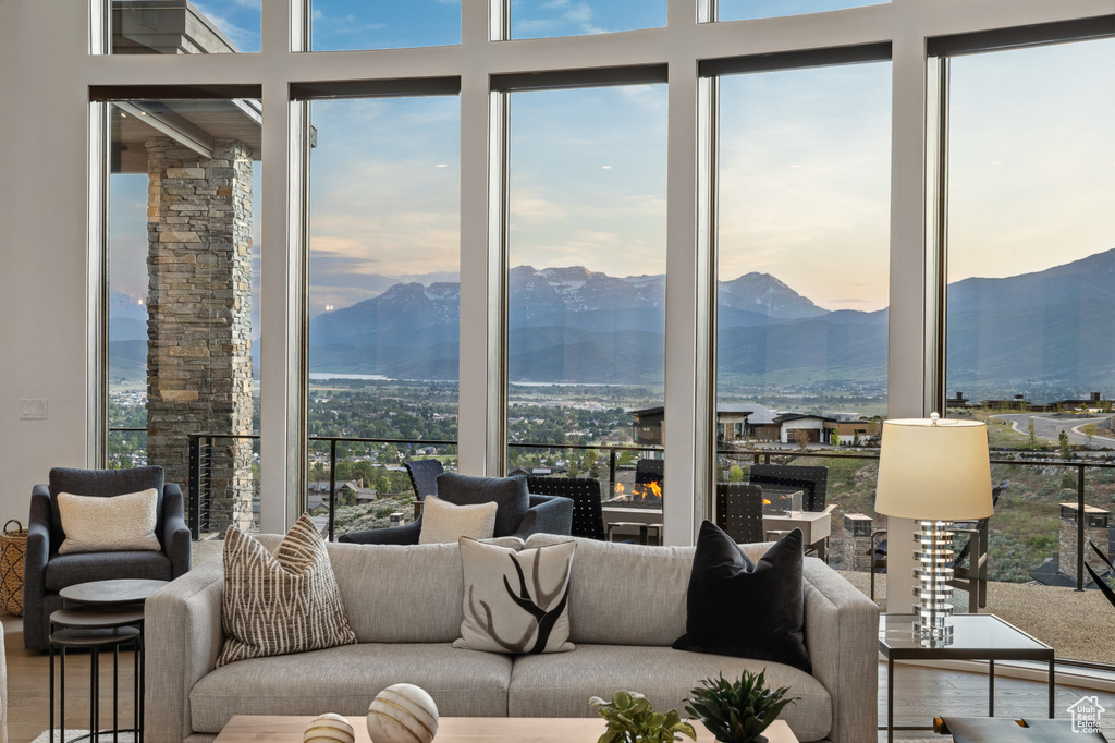 Living area with wood finished floors and a mountain view
