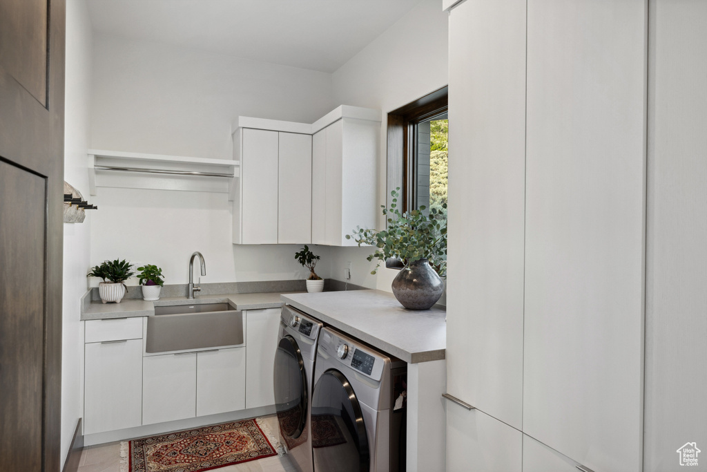 Laundry room with washer and dryer and cabinet space