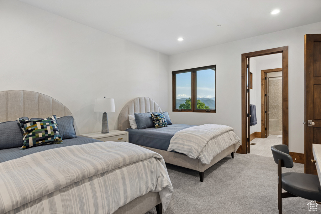 Bedroom with light carpet and recessed lighting