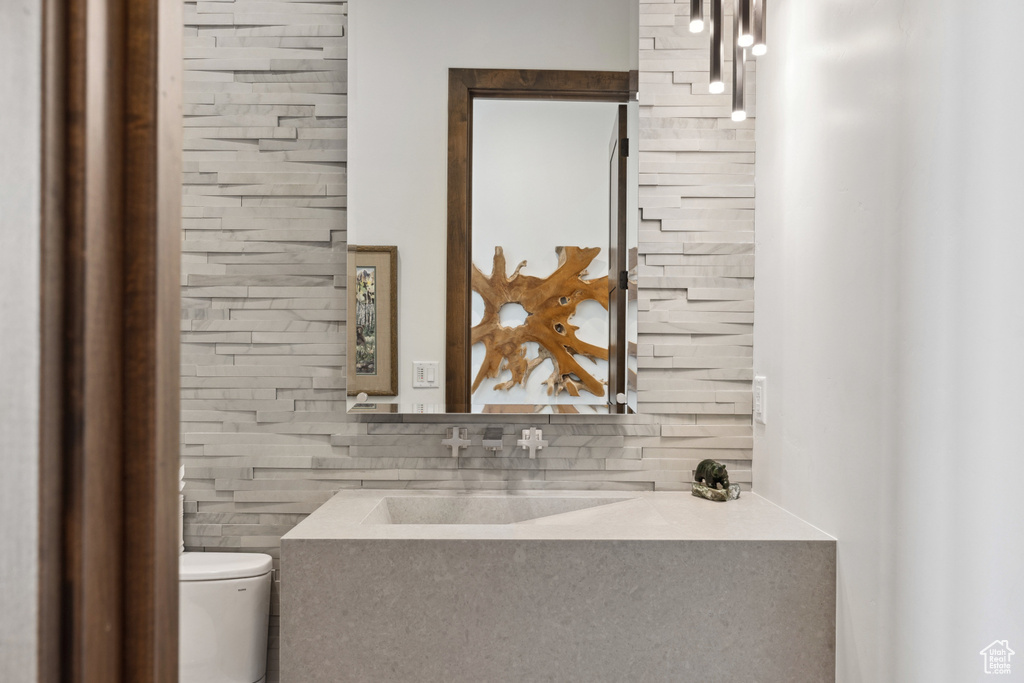 Bathroom with toilet and vanity
