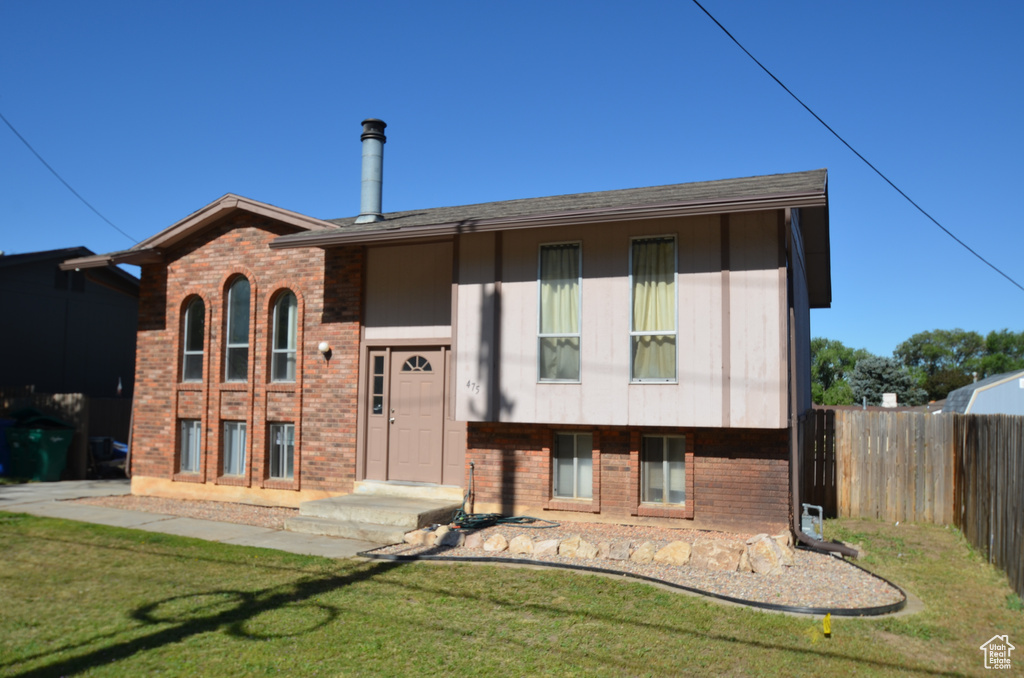 Bi-level home with brick siding