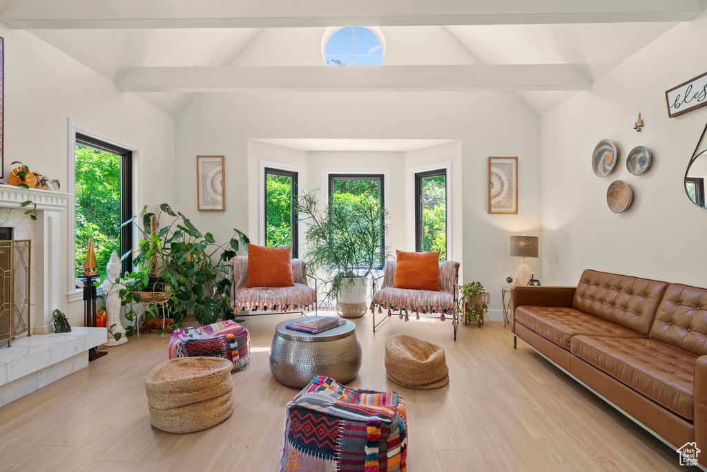 Living area with wood finished floors and a premium fireplace