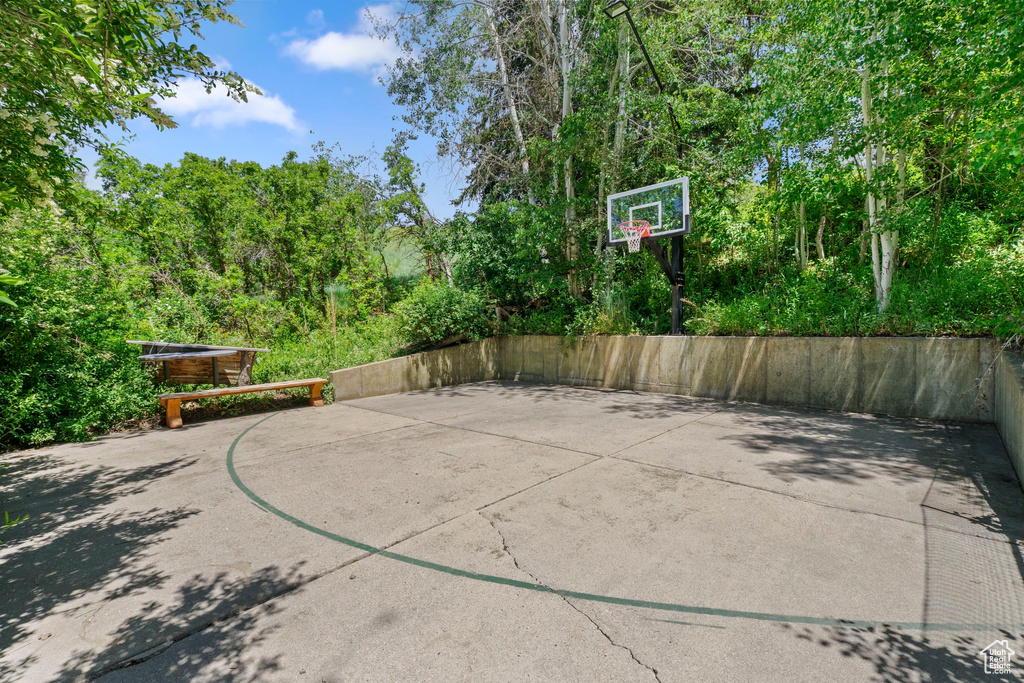 View of basketball court featuring basketball hoop