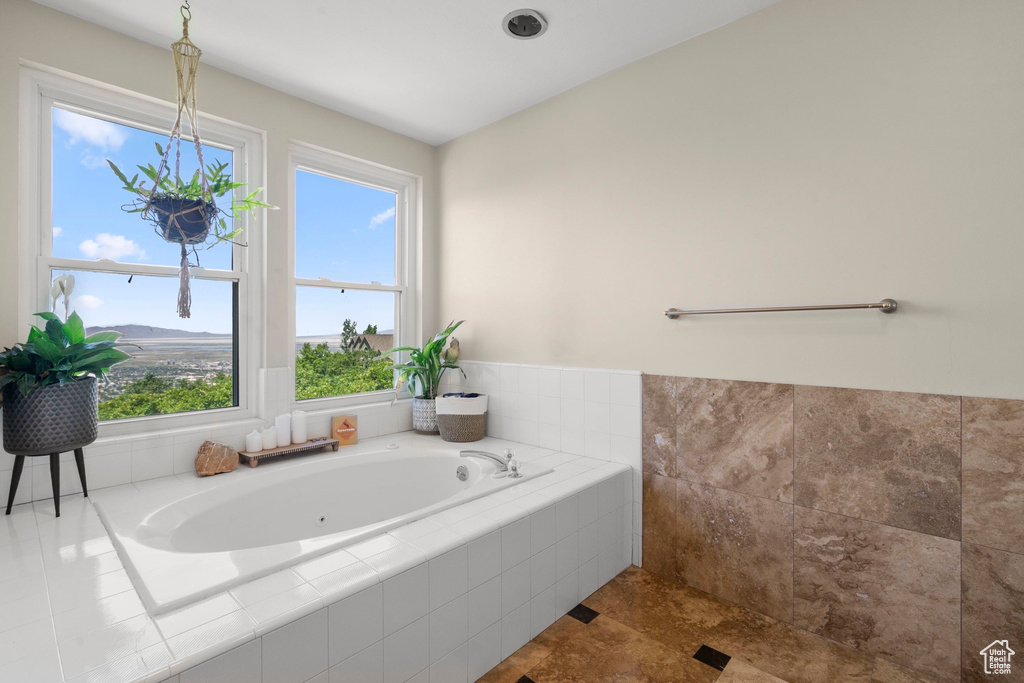 Full bath featuring a bath