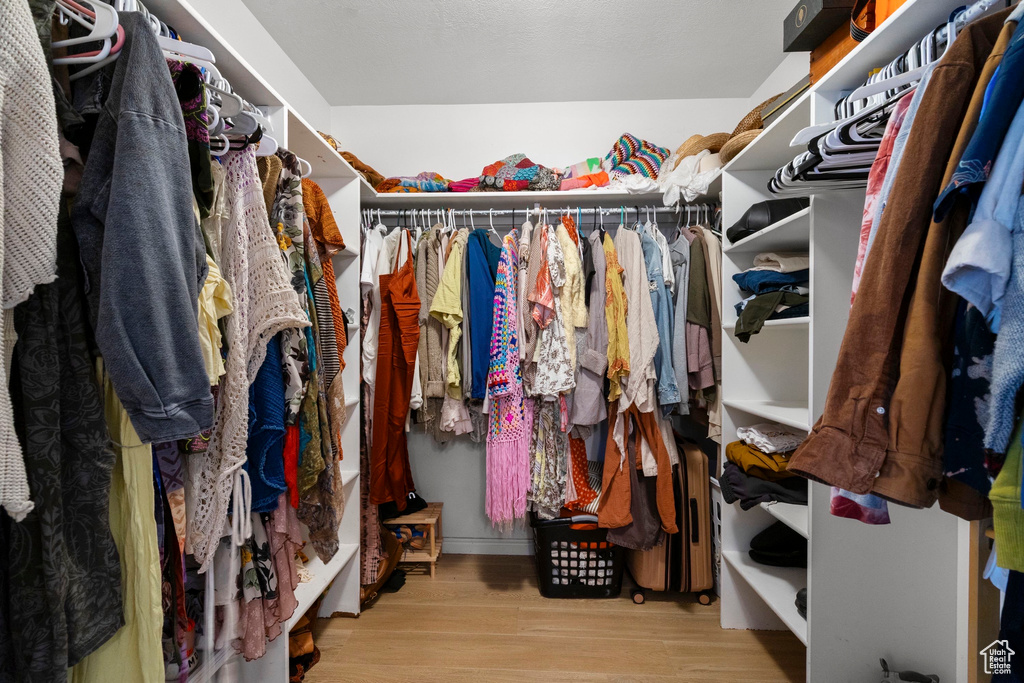 Spacious closet with wood finished floors