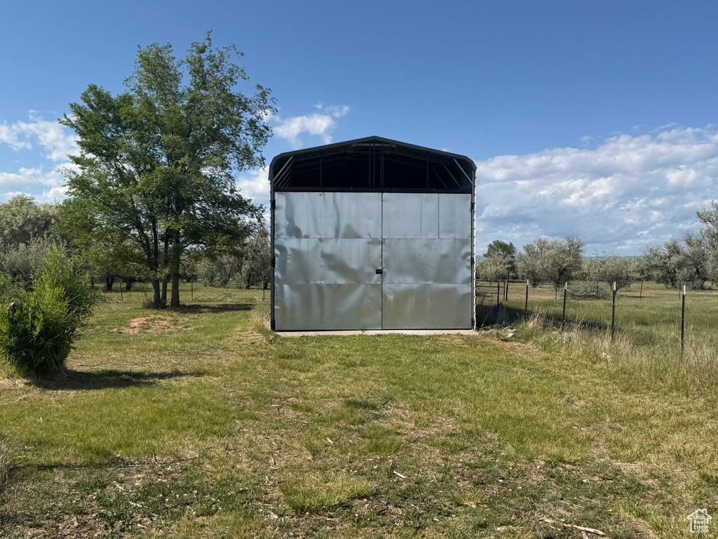 View of outdoor structure featuring a carport