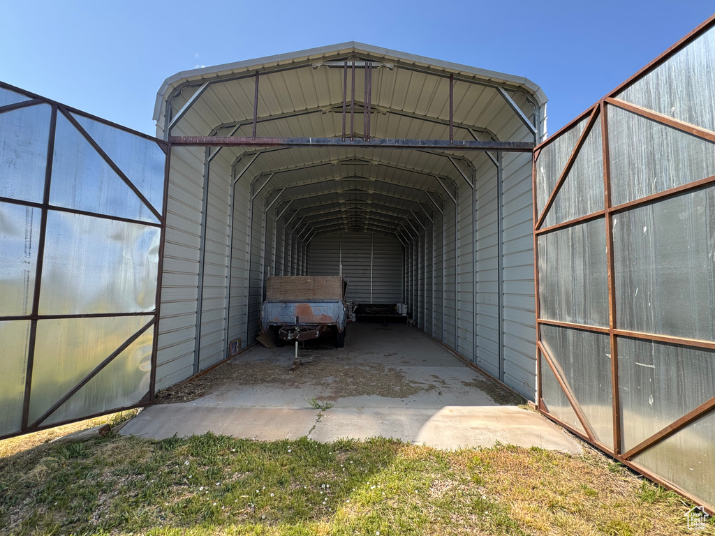 View of car parking featuring a carport