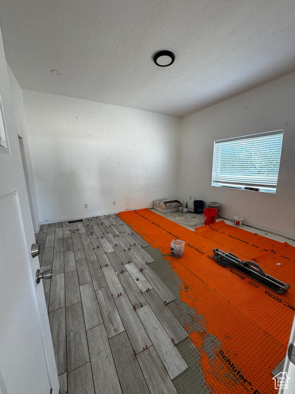 Unfurnished room with wood finished floors
