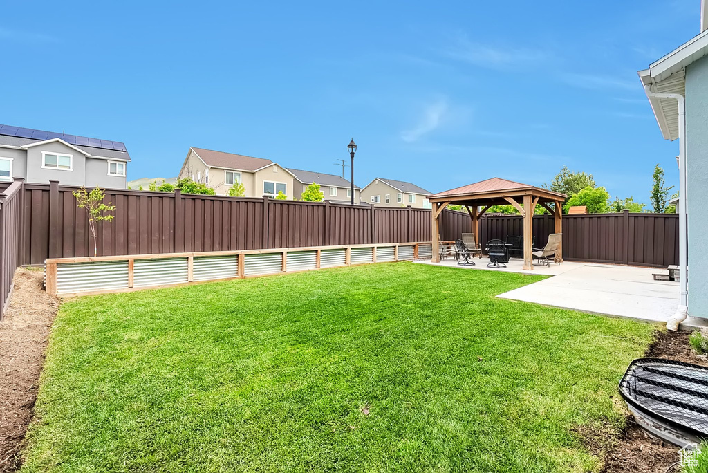 View of yard with a gazebo, a patio area, and a residential view