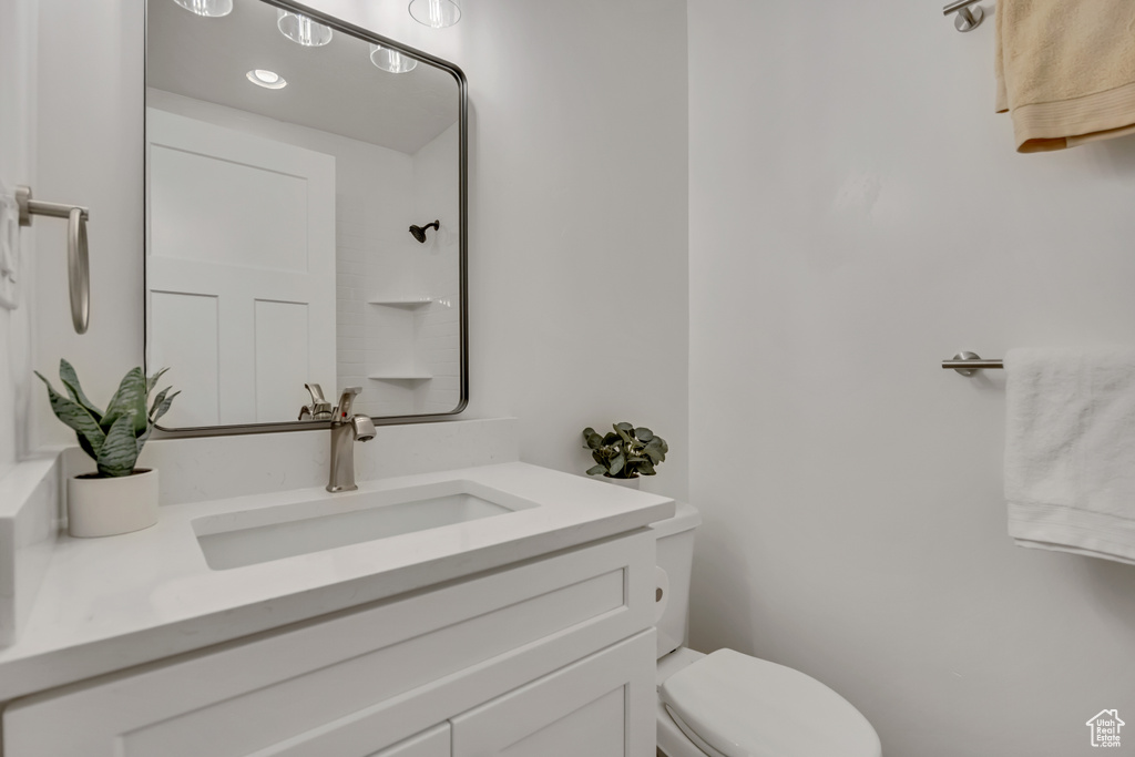 Bathroom with toilet and vanity