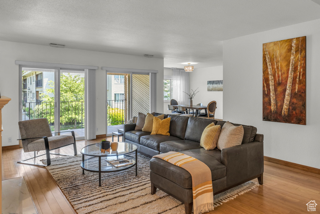 Living area with hardwood / wood-style floors and baseboards