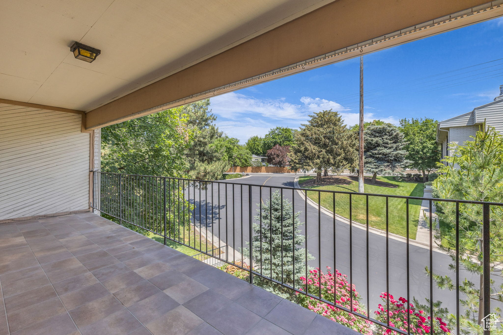 View of patio featuring a balcony