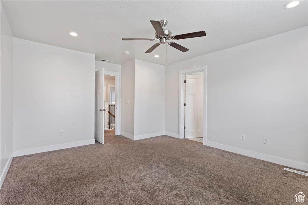 Unfurnished bedroom with carpet floors, recessed lighting, baseboards, and ceiling fan