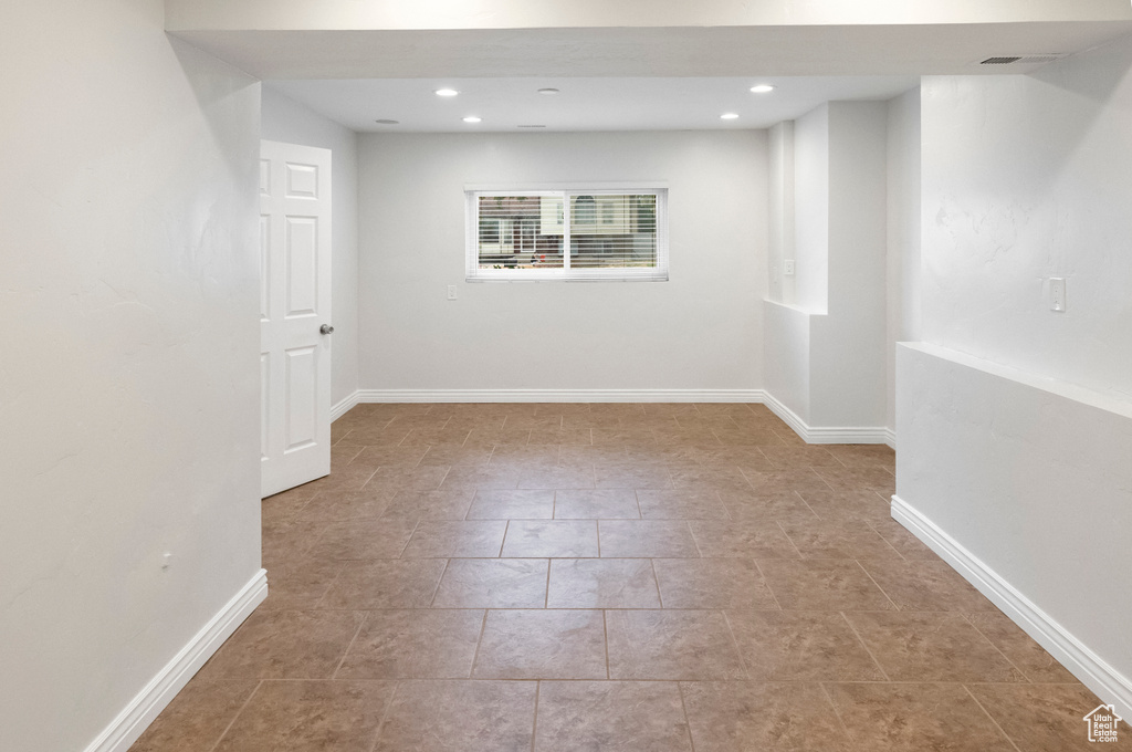 Below grade area with recessed lighting and baseboards
