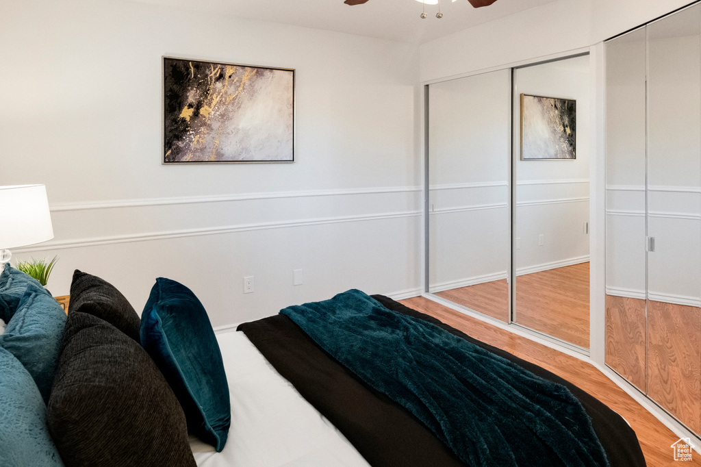 Bedroom featuring wood finished floors and a ceiling fan