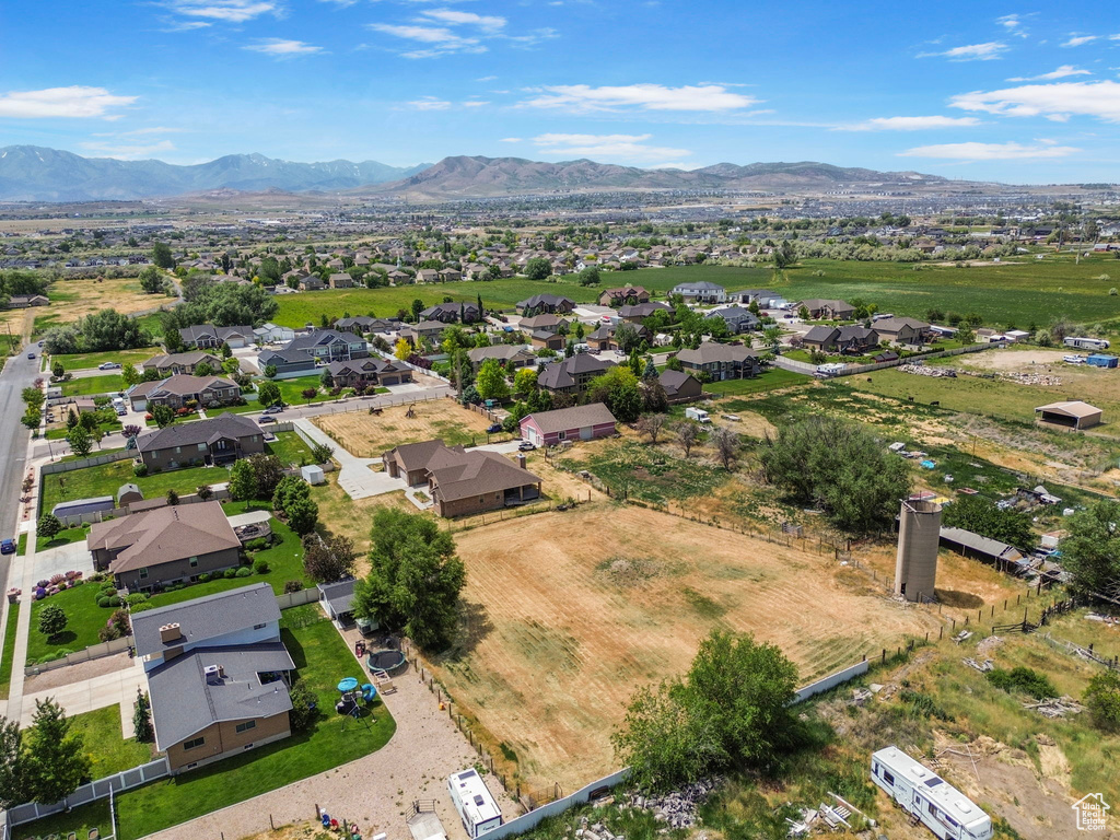 Aerial view of residential area featuring a mountainous background