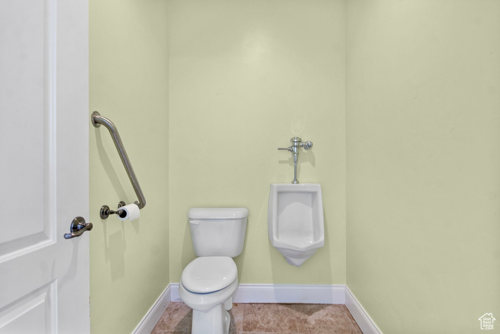 Bathroom with baseboards and toilet