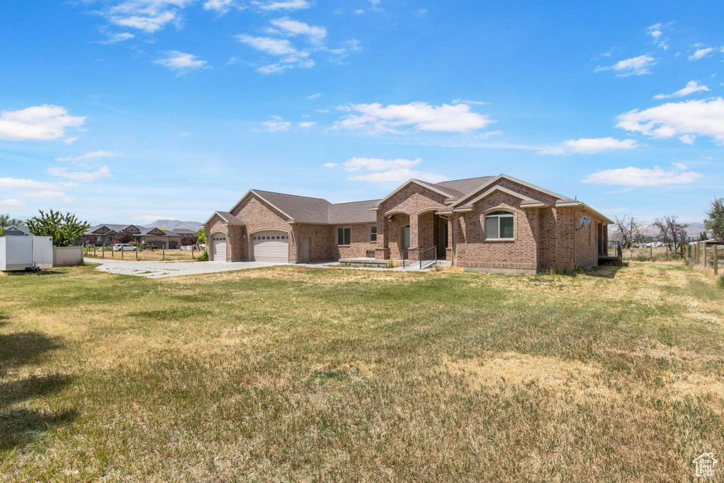 Ranch-style home with brick siding, a garage, and concrete driveway