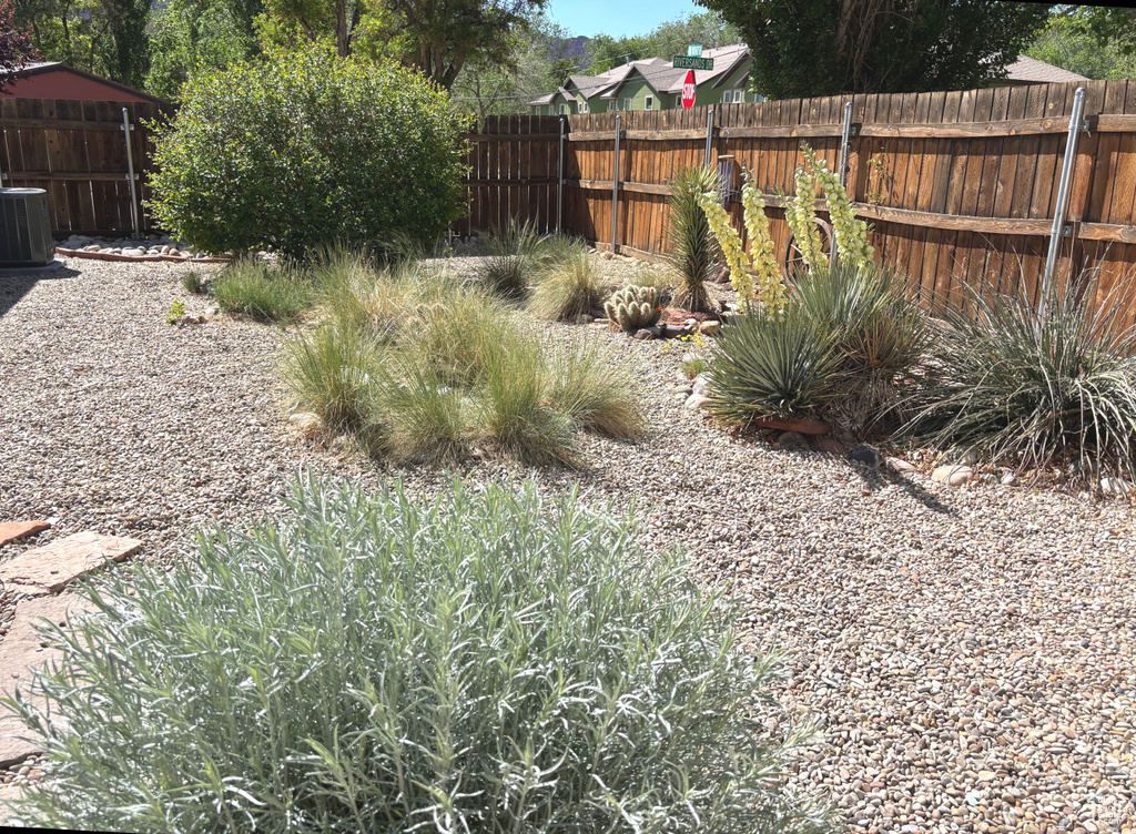 Fenced backyard with central AC