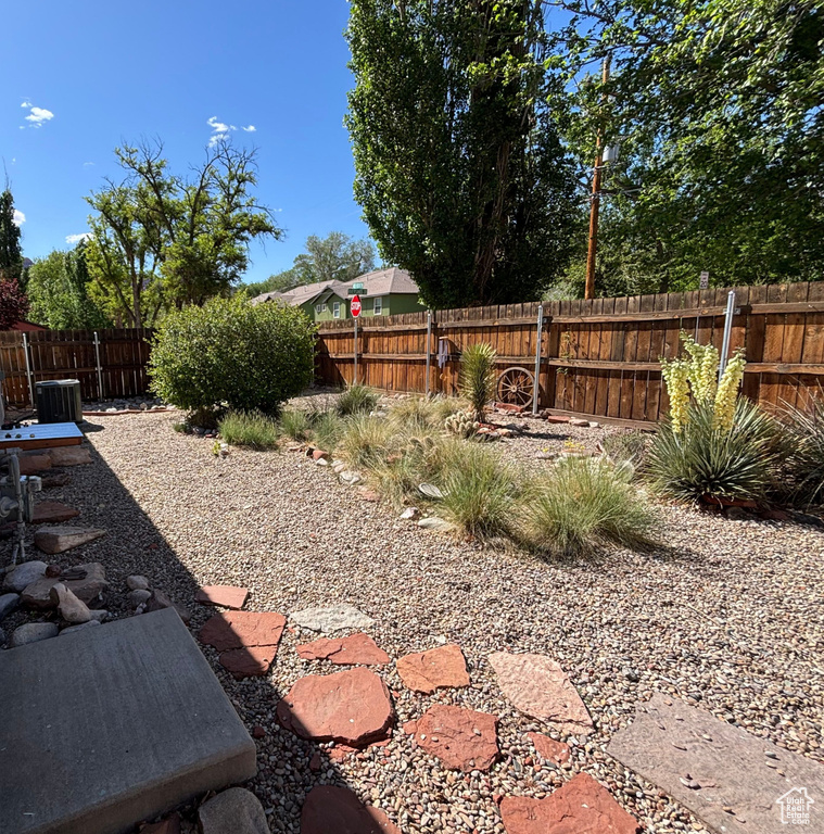 Fenced backyard with cooling unit