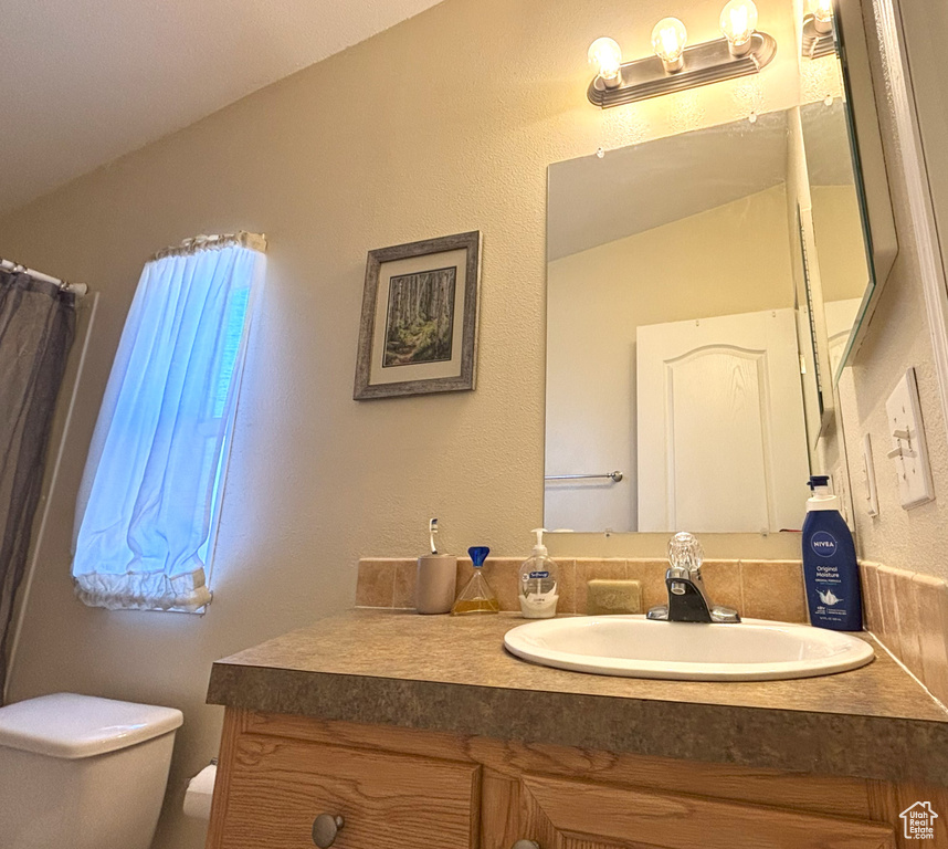 Bathroom featuring toilet and vanity