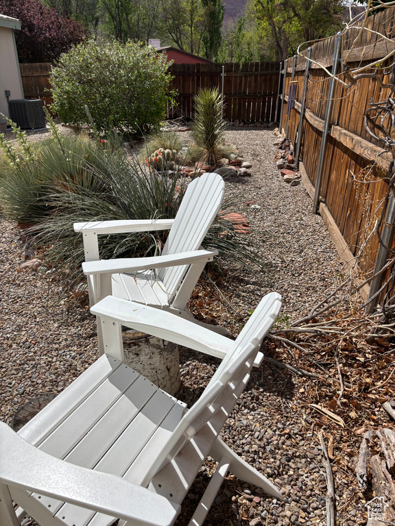 Fenced backyard with central AC