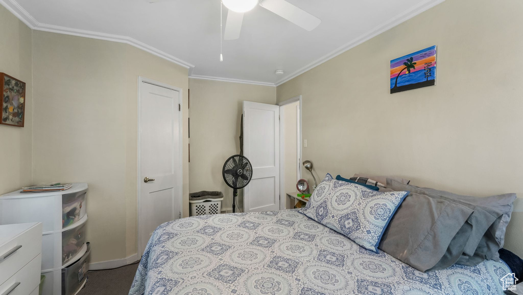 Bedroom with crown molding and a ceiling fan