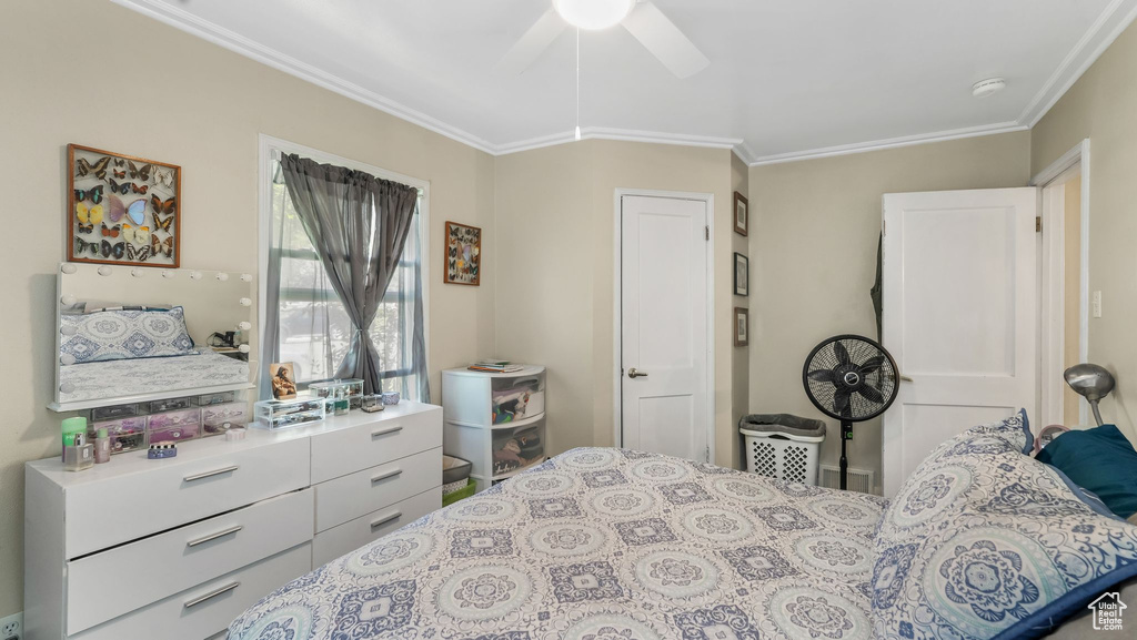 Bedroom featuring crown molding and ceiling fan
