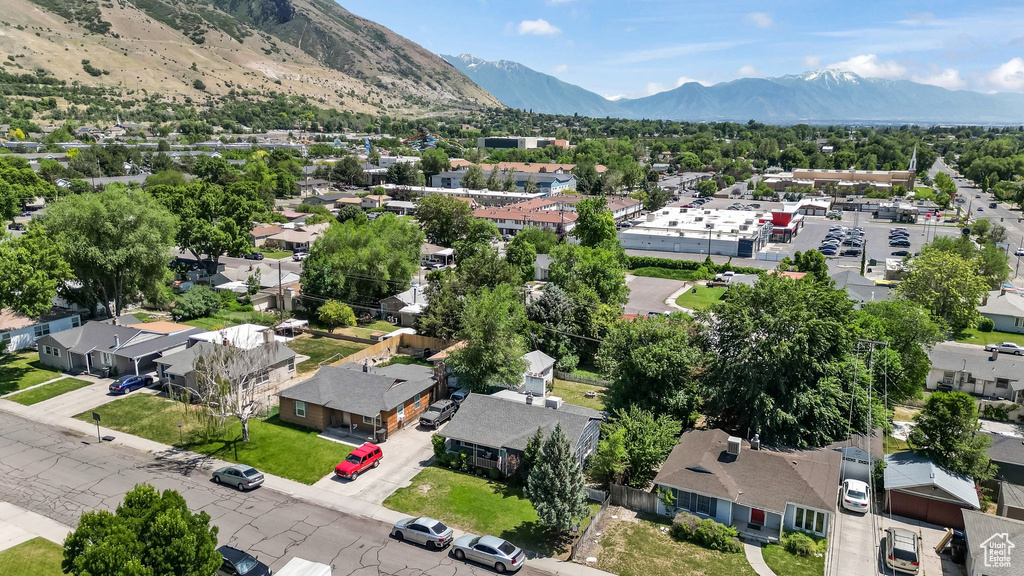 Aerial view of residential area featuring a mountain backdrop