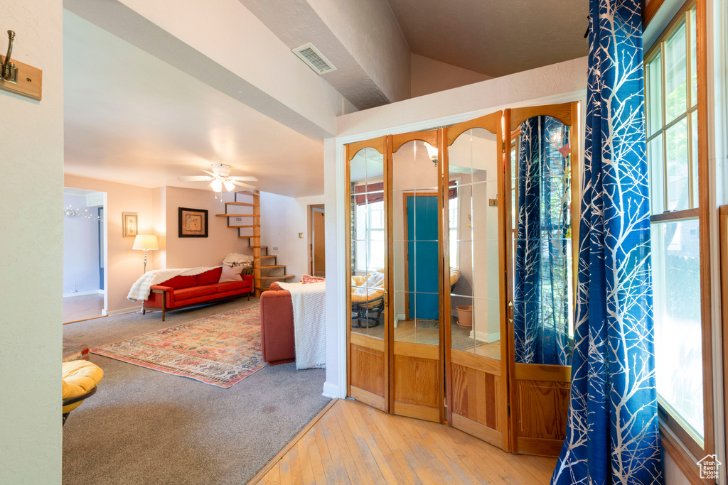 Entryway with hardwood / wood-style floors and ceiling fan