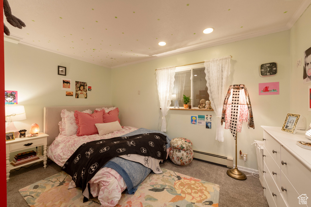 Carpeted bedroom with a baseboard radiator, recessed lighting, ornamental molding, and baseboards