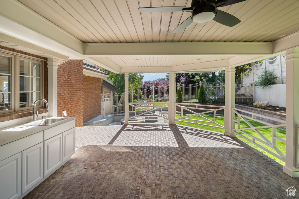 View of patio / terrace with a sink and a ceiling fan