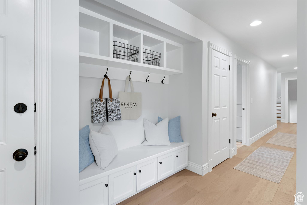Mudroom with light wood-style flooring, recessed lighting, and baseboards