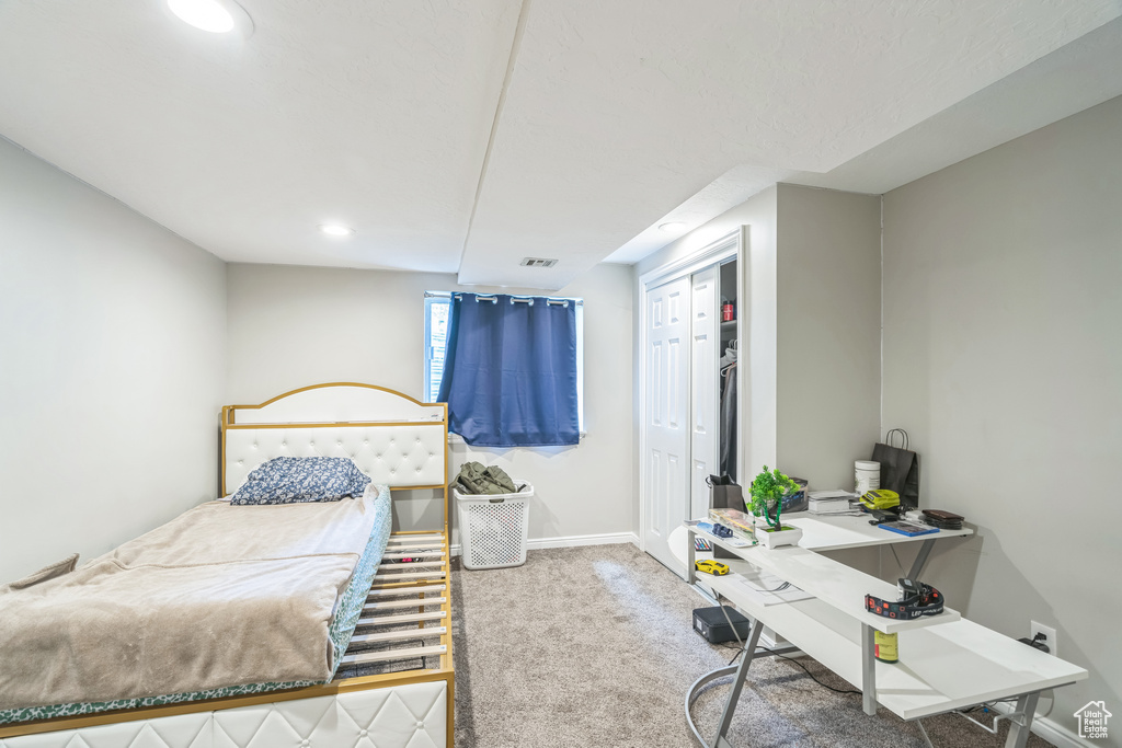 Bedroom featuring carpet, recessed lighting, baseboards, a closet, and an office area