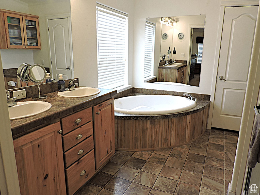 Bathroom with double vanity and a bath