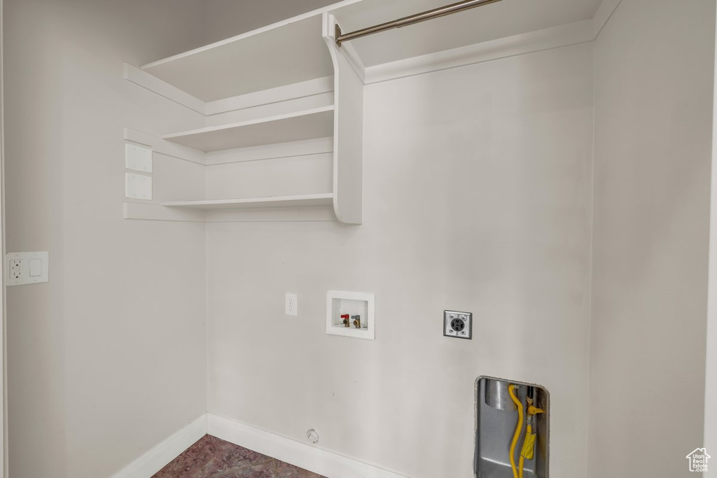 Laundry room with electric dryer hookup, baseboards, hookup for a washing machine, and hookup for a gas dryer