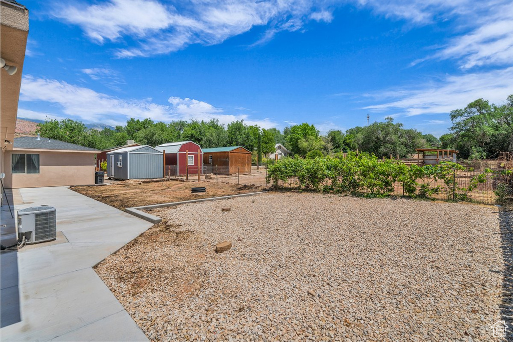 View of yard with central AC