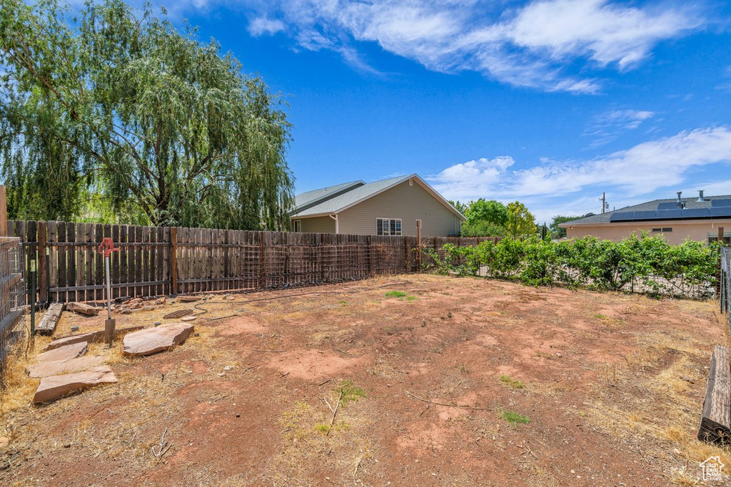 View of fenced backyard