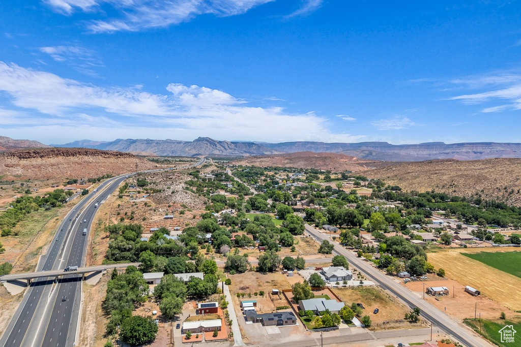 Drone / aerial view of a mountainous background and a main thoroughfare