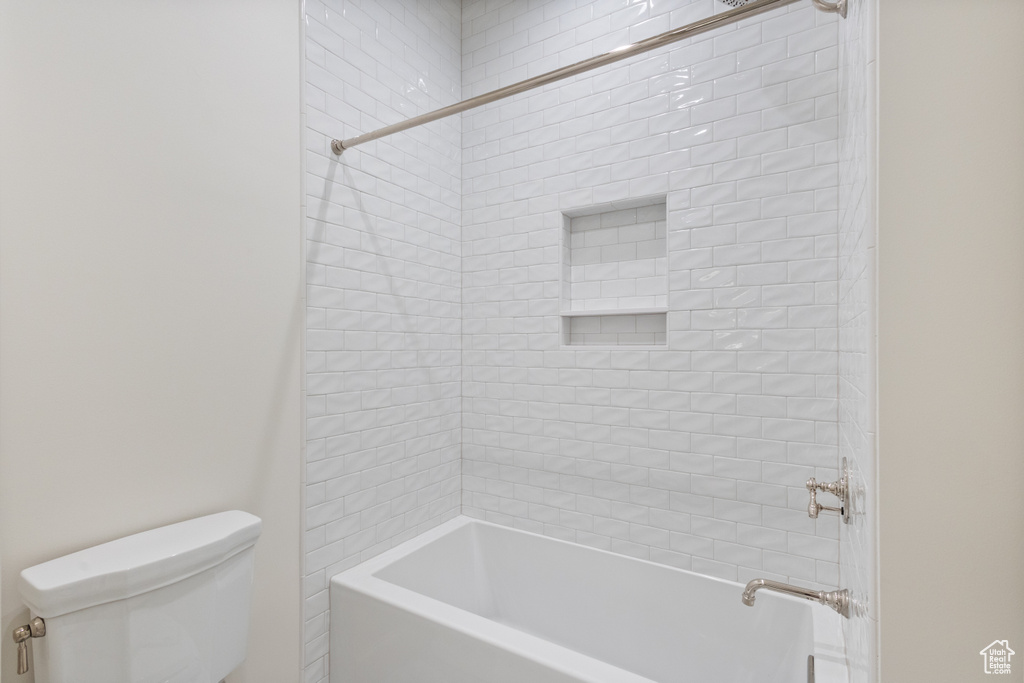 Bathroom with toilet and shower / bathtub combination