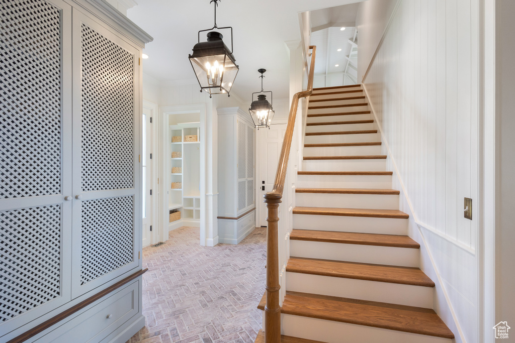 Staircase with brick patterned flooring