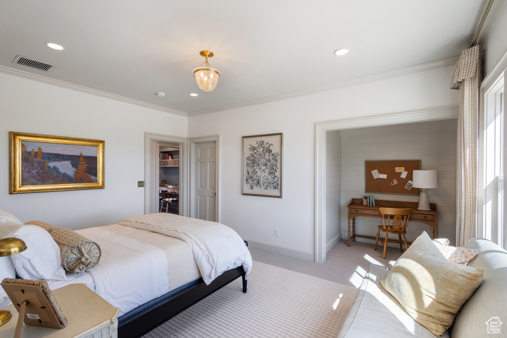 Bedroom with ornamental molding, recessed lighting, light carpet, and baseboards