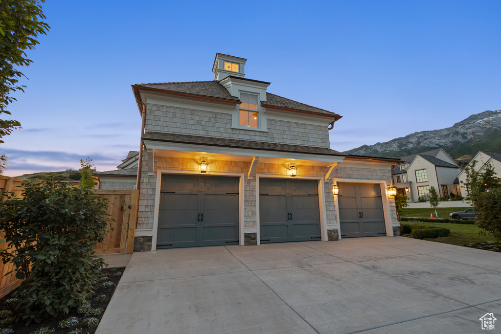 Garage with a mountain view and driveway