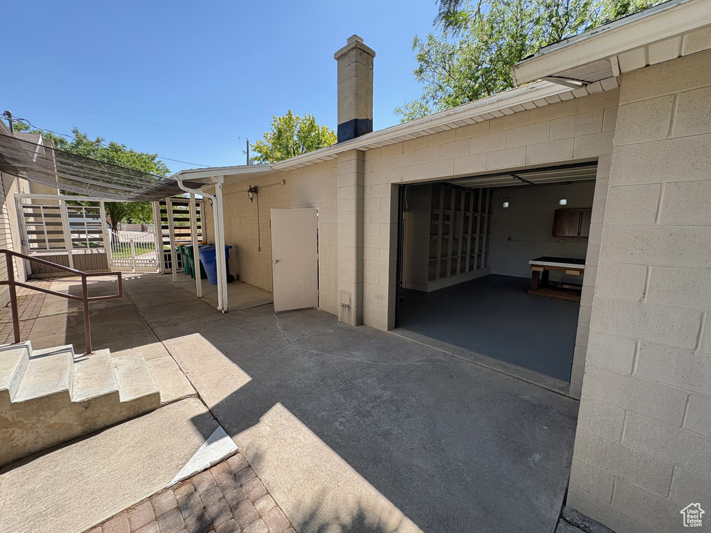 Garage featuring driveway